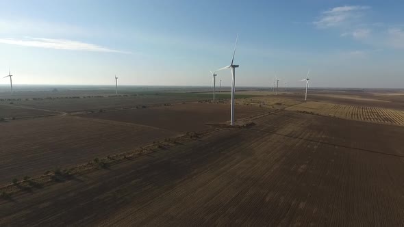 Rotating Turbines of a Wind Farm. Renewable Energy. Aerial alt
