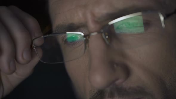Laptop Screen With Files Reflected in Glasses, Detective Working at Night alt