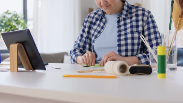 Woman Making Paper Craft at Home alt