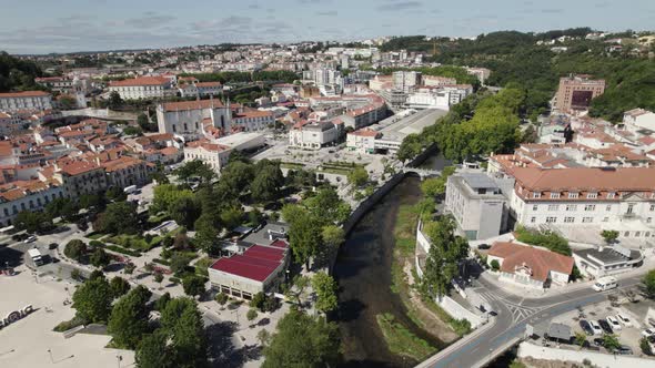 Lis river crossing Leiria city, aerial view of Portuguese town downtown