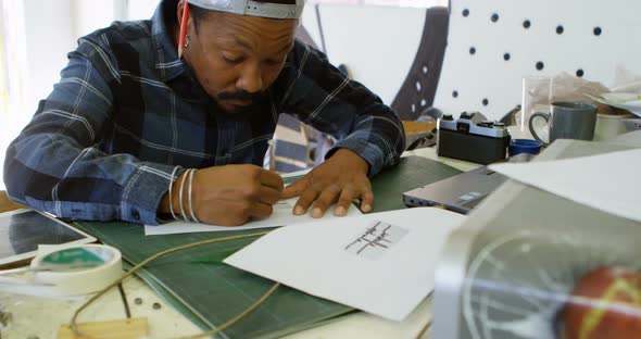 Man drawing design on paper  alt