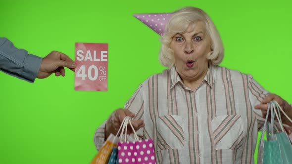 Advertisement Sale 40 Percent Off Appears Next To Grandmother. Woman Celebrating with Shopping Bags alt