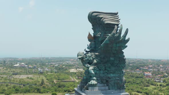 Aerial Shot Circling the Garuda Wisnu Kencana Statue in Bali Indonesia alt