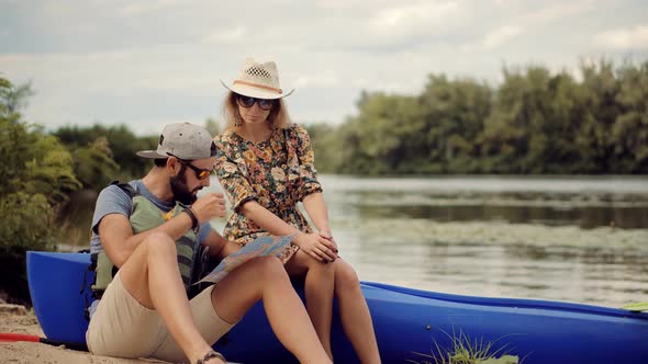 Traveling On River Holding Tourist Map For Navigate. Kayak Or Canoe Boat Rowing In Summer Weekend. alt