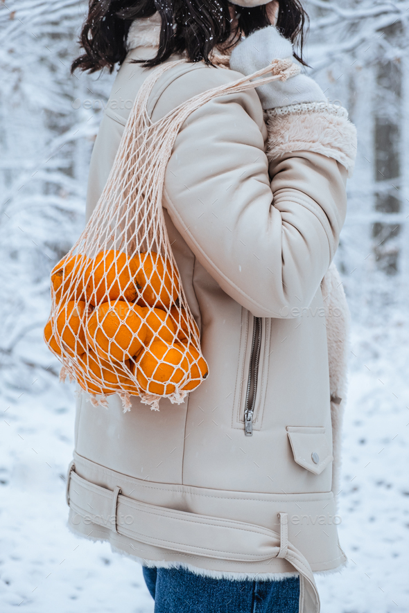 Christmas or New Year composition with fresh tangerines in shopping bag and  word December, Stock image
