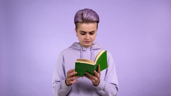 Female Student Turning Pages of Book Passionate About Story Indoors alt