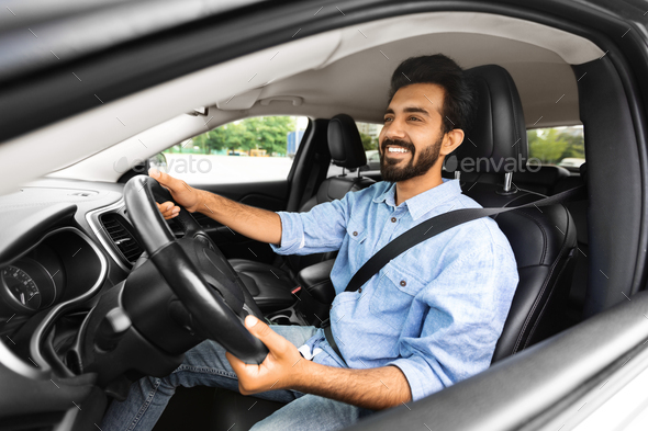 Premium Photo  Confident man sitting on driver seat in car