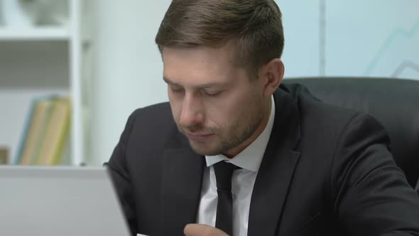 Sick Male Manager Sneezing in Tissue on Work Place, Seasonal Winter Fever