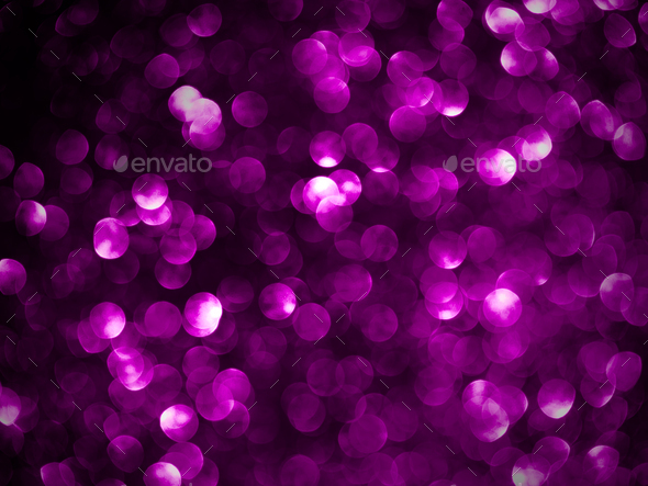 A blurry pink background with circles of light. Bokeh pink
