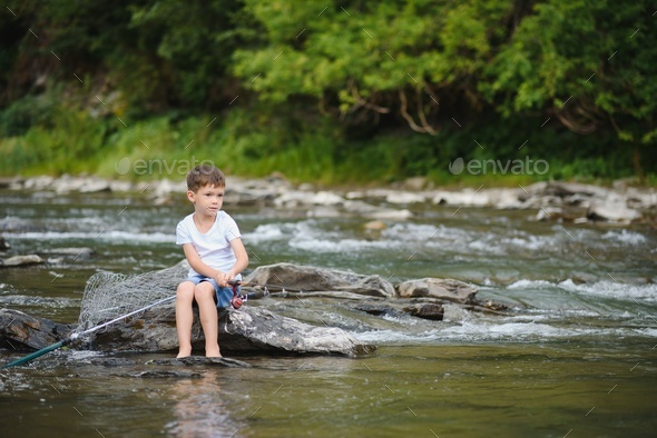 photo of little boy fishing Stock Photo by sedrik2007
