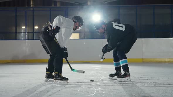 Winter Sports Confrontation of Two Hockey Players Rival Teams Start the Game Hockey Players in alt