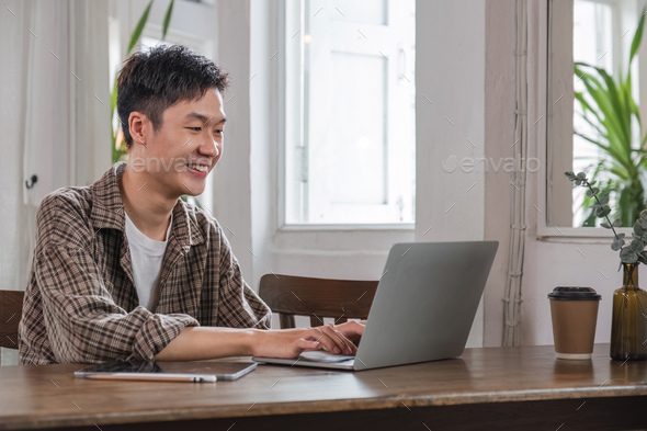 Young Asian student studying online, learning video on zoom call, teacher, happy young Asian boy