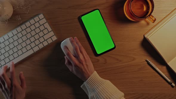 Woman Using Keyboard Mouse and Green Screen Mobile alt