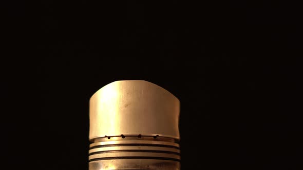 Closeup Piston From Internal Combustion Engine Spinning on Black Background alt