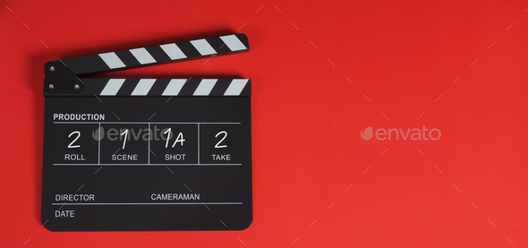 Clap board or movie slate .It is use in video and cinema industry on red background.