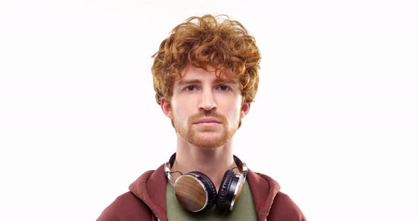 Beautiful Happy Fun Young Adult Redhead Man Listening to Music By Headphones Doing Happyserious alt