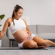 Happy Pregnant Woman Relaxing and Exercising Indoors at Home - PhotoDune Item for Sale