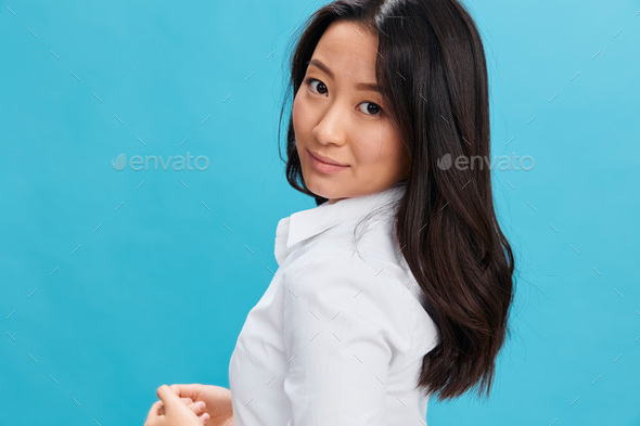 Closeup portrait of cute Asian businesswoman in classic office dress code  smile at camera posing Stock Photo by shotprime