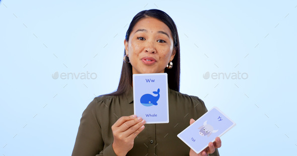 Asian woman, teacher and flash cards for teaching, education and isolated on studio background. Por