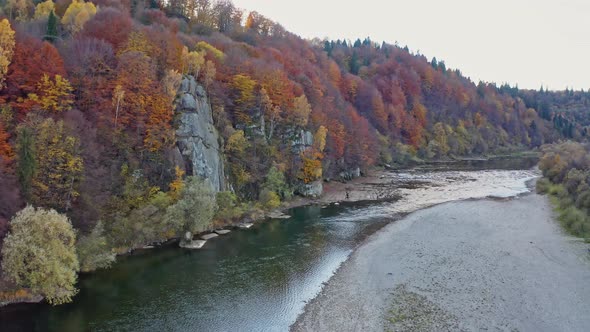 Shallow Mountain River at Foothill with Terracotta Forests alt