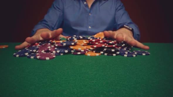 Male Player Betting All Chips in While Playing in Casino Close Up