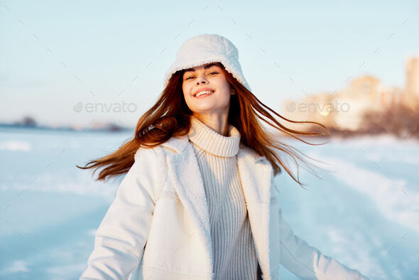 Winter woman in the snow. Beautiful girl in the winter in nature. High  quality photo Stock Photo