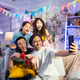 Group of Asian friends taking a selfie or video call in christmas party together - PhotoDune Item for Sale