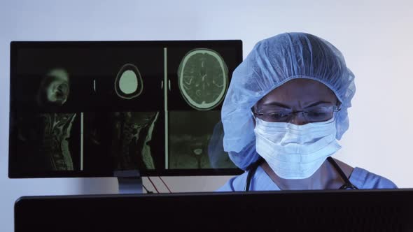 Surgeon Diagnosing CT Of Brain On Computer 15