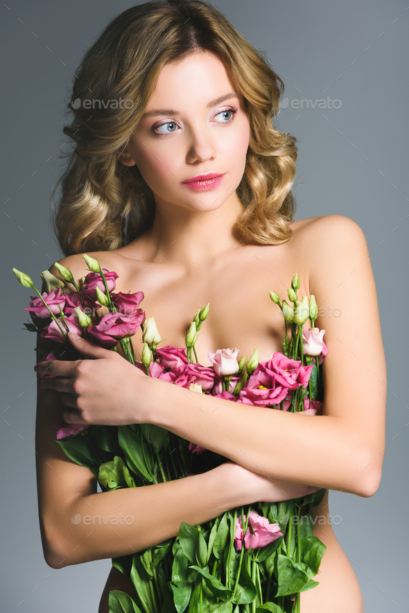 Pretty Naked Girl Holding Bouquet Of Eustoma Flowers Isolated On Grey Stock Photo By