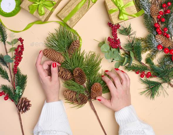 Female hand hold a box wrapped in red paper and tied with a red silk ribbon,  holiday Stock Photo by ndanko