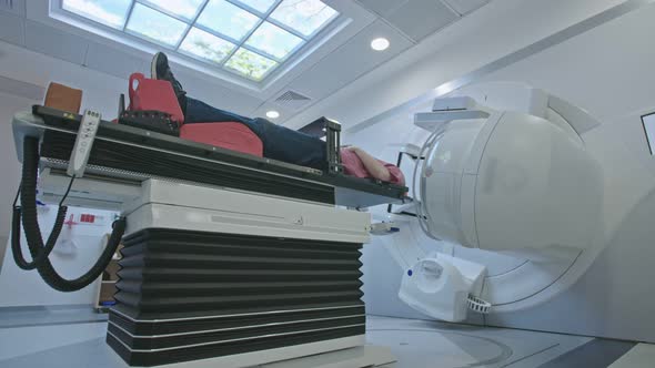 Patient Getting Radiation Therapy Treatment Inside A Modern Radiotherapy Room alt