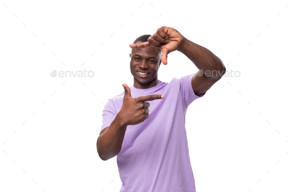 young african man of normal build dressed in a basic light lilac t-shirt with print mockup