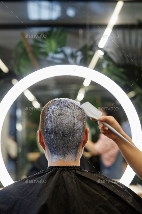 Back View of Client in Beauty Salon Bleaching Buzzcut Hair