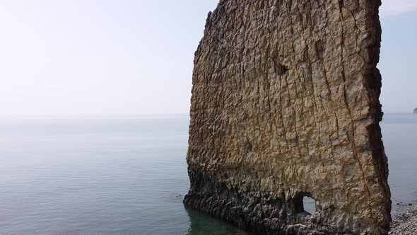 An unusual rock standing in the sea