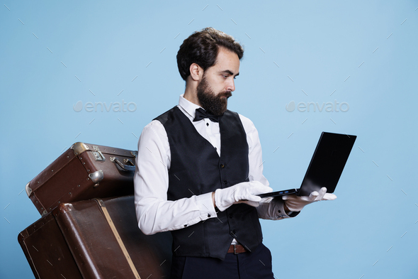 Hotel employee using laptop