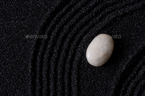 Zen Garden with White stone on Black Sand Wave Pattern in Japanese stye,Meditation,Zen like concept