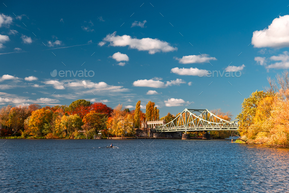 View of Glienicker Brücke or Bridge of Spies in Potsdam Germany in autumn with colorful trees - Stock Photo - Images