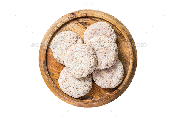 Raw chicken patty cutlet with breadcrumbs. Isolated, white background. Top view.