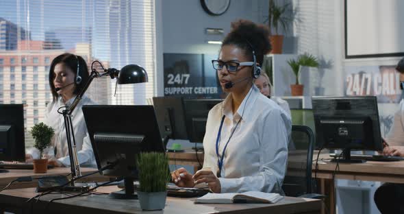 Young Woman Working at Her Desk alt