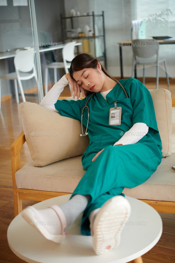 Tired Nurse Sleeping on Couch