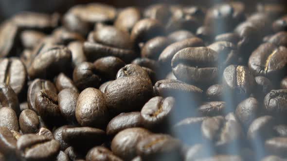 coffee beans with smoke in slow motion.