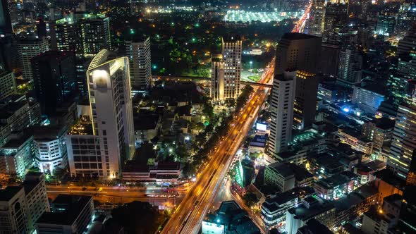 Traffic at night during rush hour, Bangkok business district, zoom out – Time Lapse