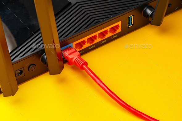 Colored network cable patch-cord on yellow background