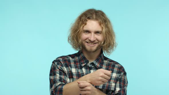 Slow Motion of Handsome Modern Guy with Blond Wavy Hair and Beard Enjoying Music Playing Air Drums