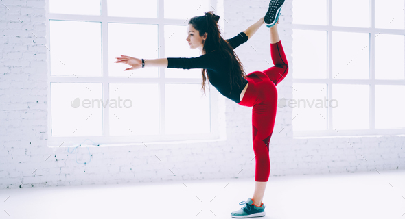 young fit woman reaching fitness goals during hard workout slimming and  training muscles Stock Photo by GaudiLab