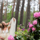 Blurred image of a romantic couple behind the splash of water from a garden sprinkler - PhotoDune Item for Sale