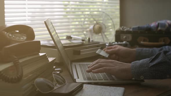 Man doing shopping online with his credit card