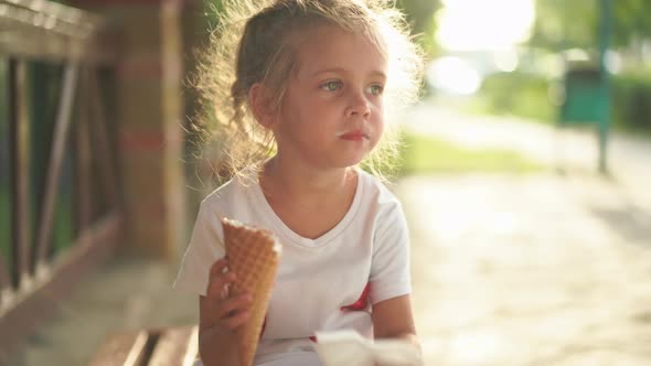 Little Girl Eat Ice Cream Outdoor alt