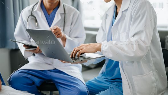 Hospital Ward. Doctor Talks With Professional Head Nurse or Surgeon, They Use Digital tablet