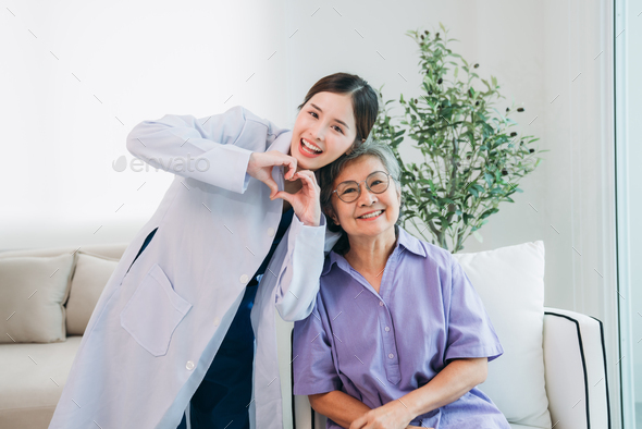 Medical staff taking and caregiver senior woman in Home. Healthcare and Home Care Concept.
